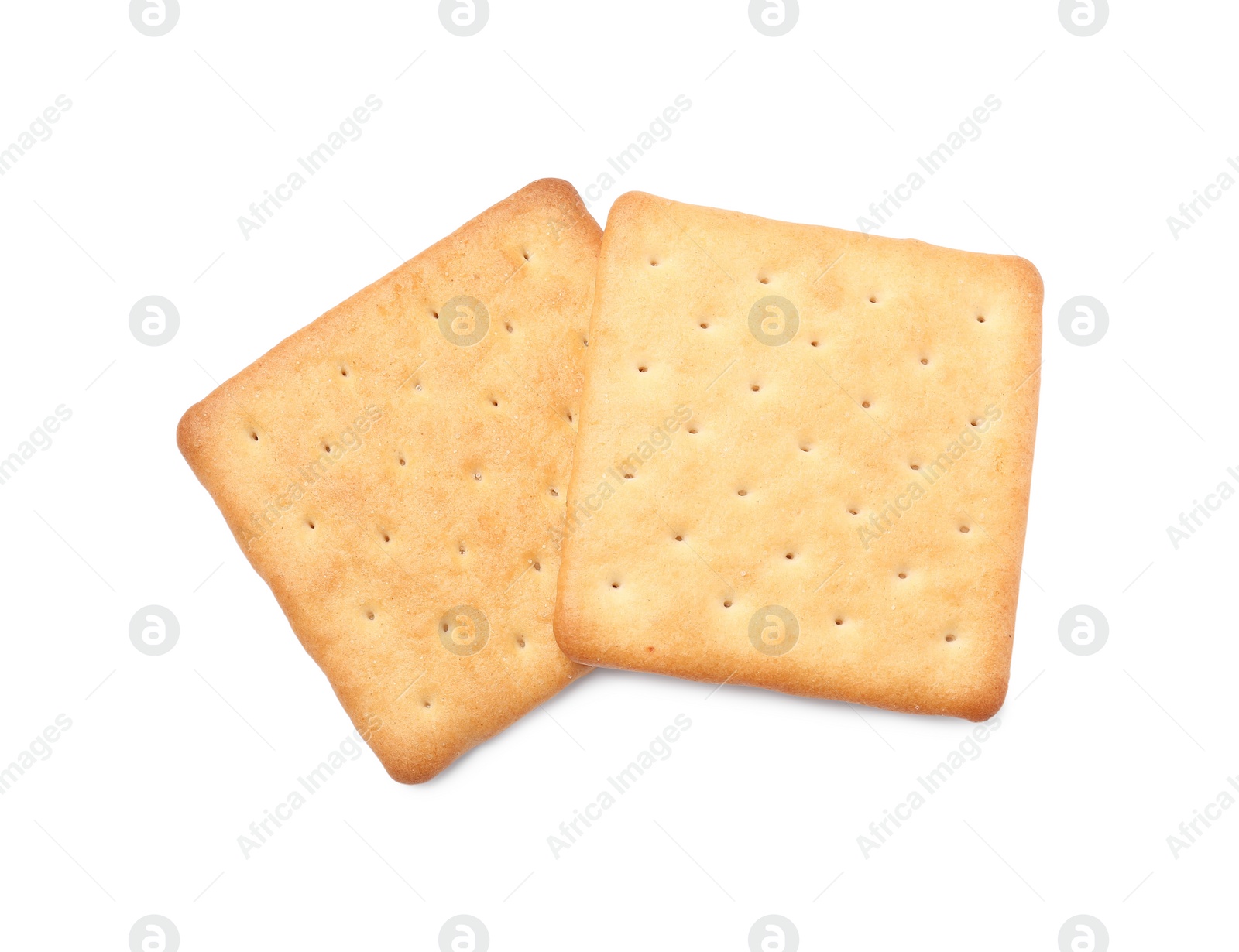 Photo of Two crispy crackers isolated on white, top view. Delicious snack