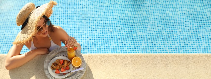 Image of Young woman with delicious breakfast in swimming pool, banner design