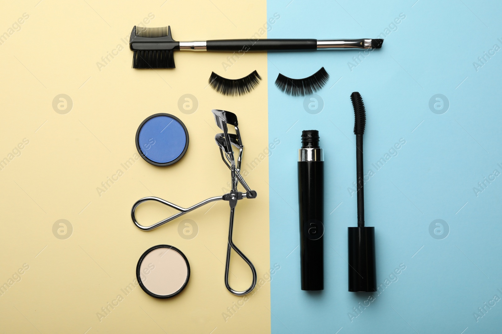 Photo of Flat lay composition with artificial eyelashes and accessories on color background