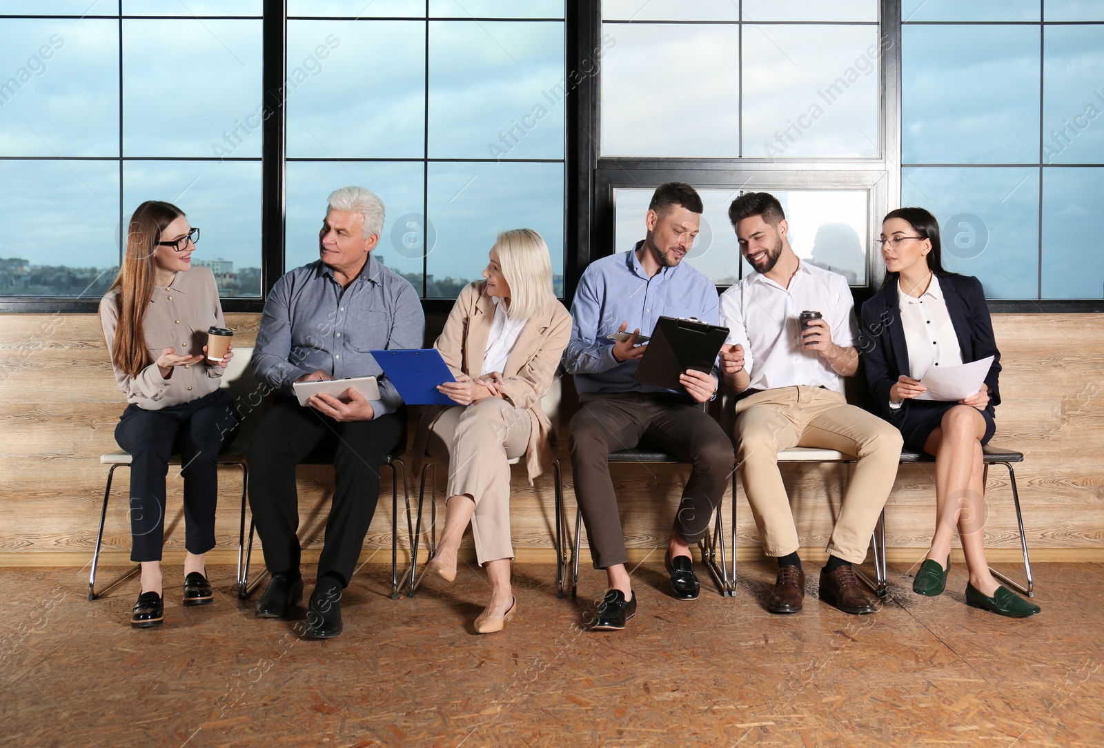 Photo of People waiting for job interview in office hall