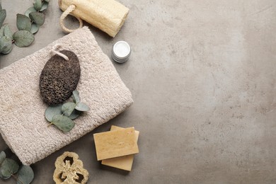 Flat lay composition with pumice stone on grey background. Space for text