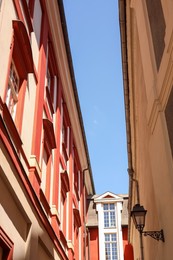 Photo of Beautiful old buildings against blue sky, low angle view