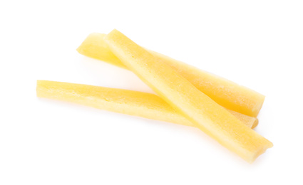 Photo of Raw yellow carrot sticks isolated on white