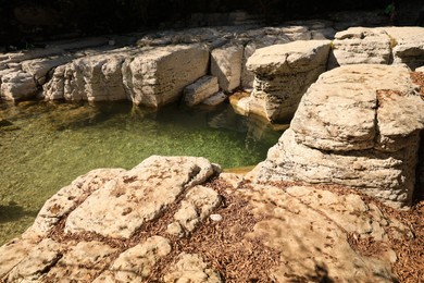 Beautiful clean pond and many rocks outdoors