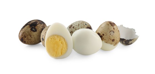 Unpeeled and peeled hard boiled quail eggs on white background