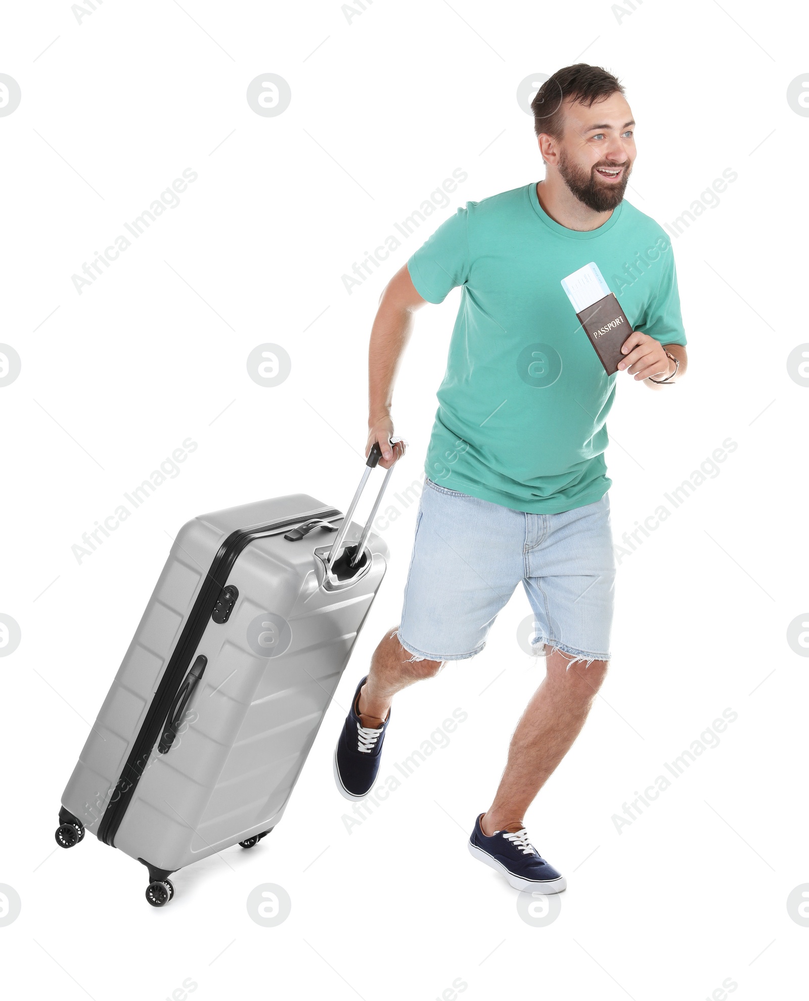 Photo of Man with suitcase and passport running on white background. Vacation travel