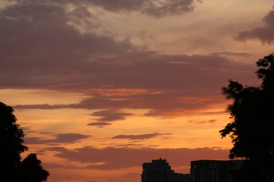 Photo of Silhouette of city with buildings against sky at sunset