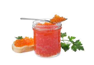 Photo of Delicious red caviar, tasty sandwich and parsley on white background