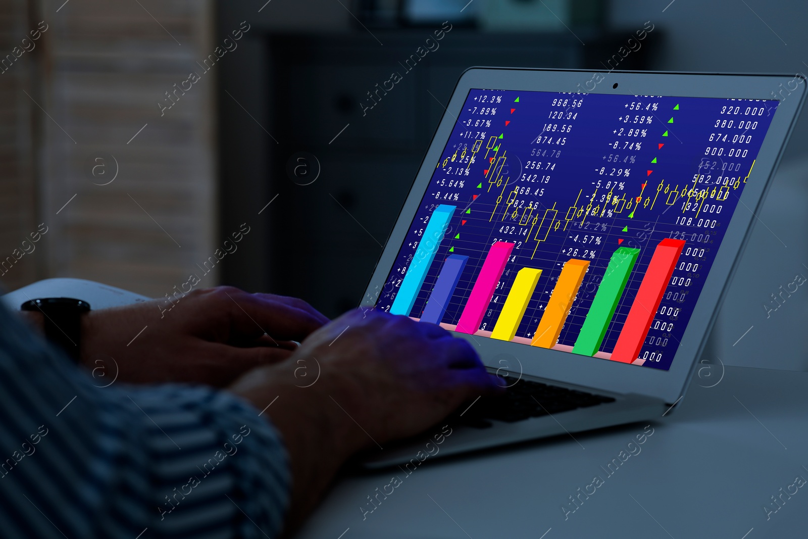 Image of Man analyzing situation on stock exchange market via laptop, closeup. Data and graph on screen