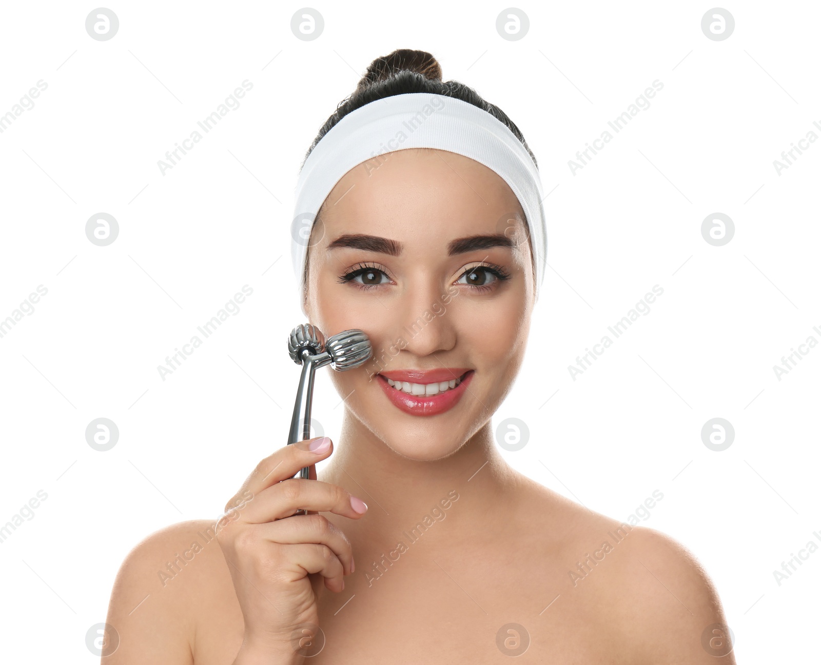 Photo of Woman using metal face roller on white background