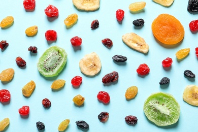 Photo of Flat lay composition with different dried fruits on color background. Healthy lifestyle