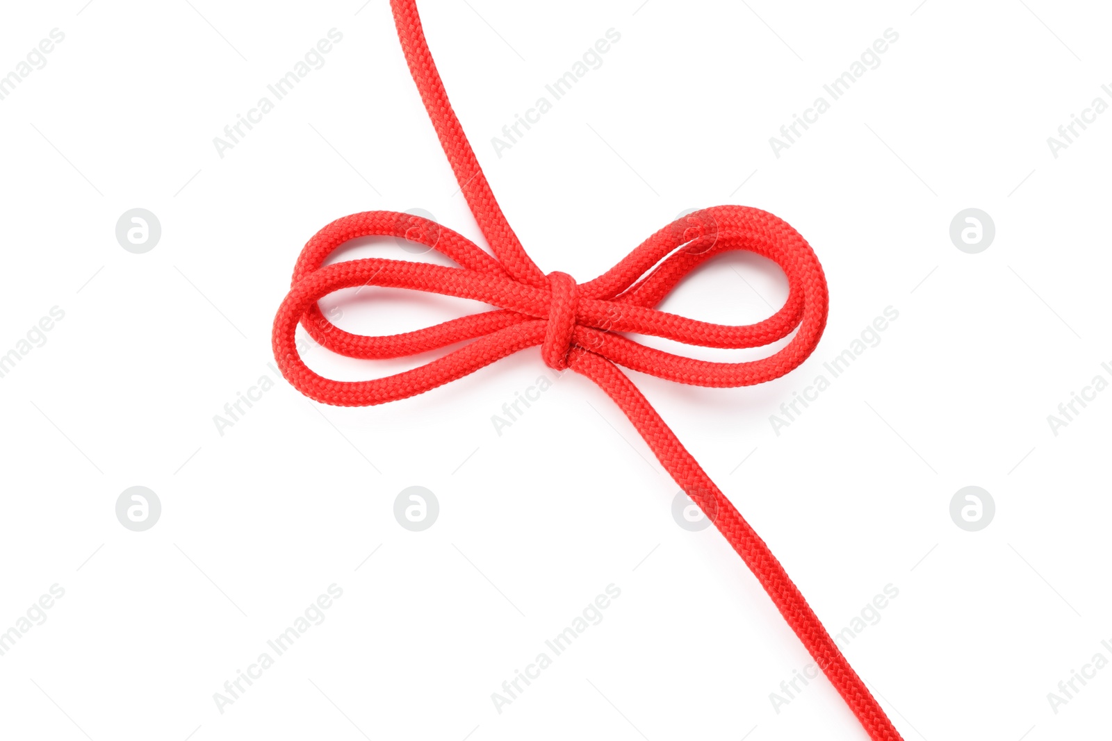 Photo of Red shoe lace tied in bow isolated on white, top view