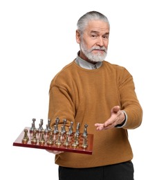 Man showing chessboard and game pieces on white background