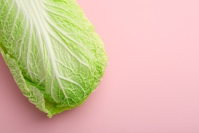 Photo of Fresh ripe Chinese cabbage on pink background, top view. Space for text