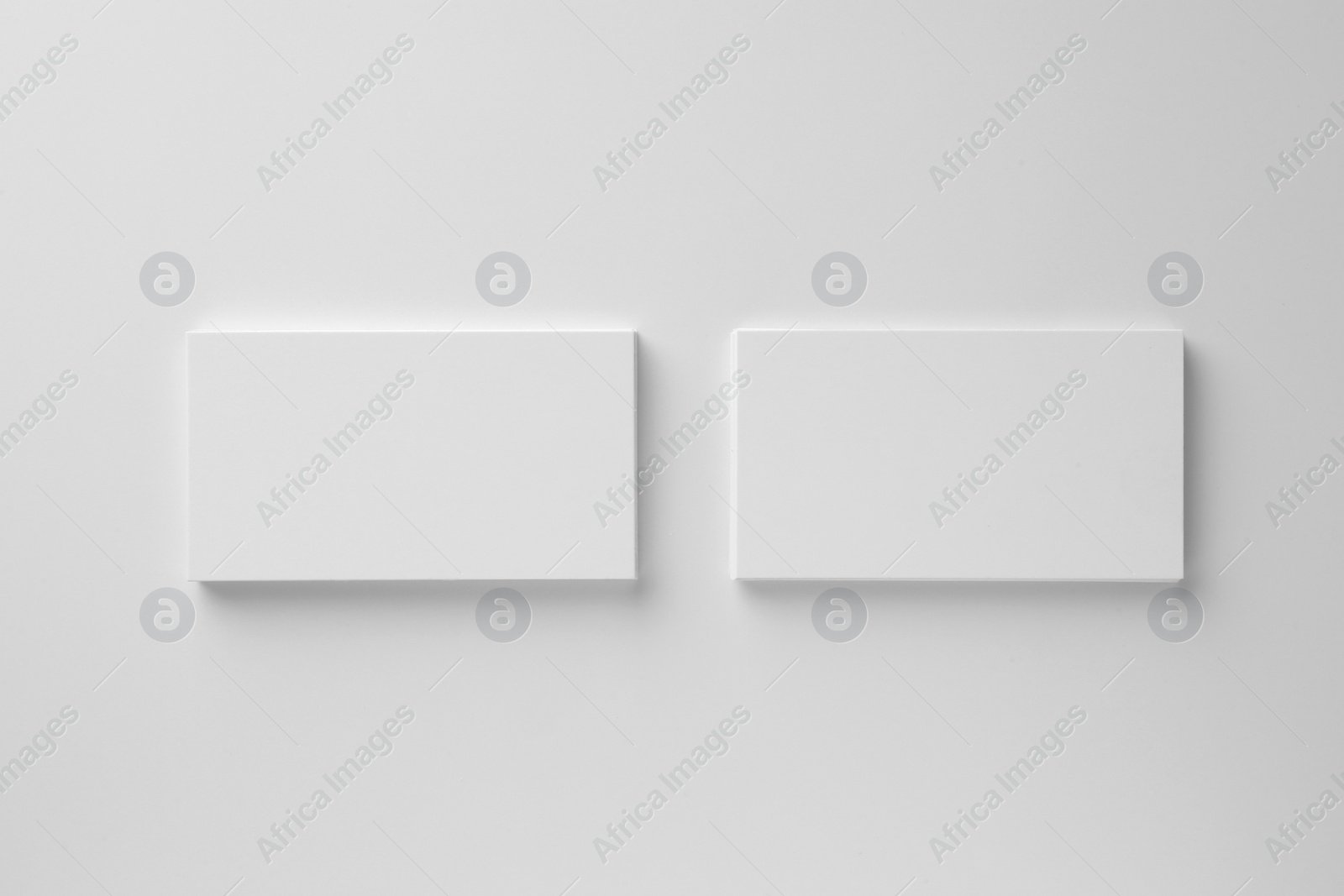 Photo of Blank business cards on white background, top view. Mockup for design