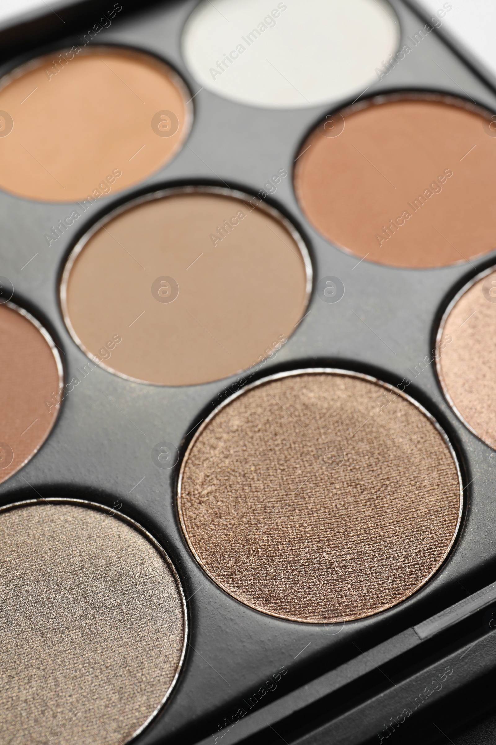 Photo of Beautiful eye shadow palette on table, closeup