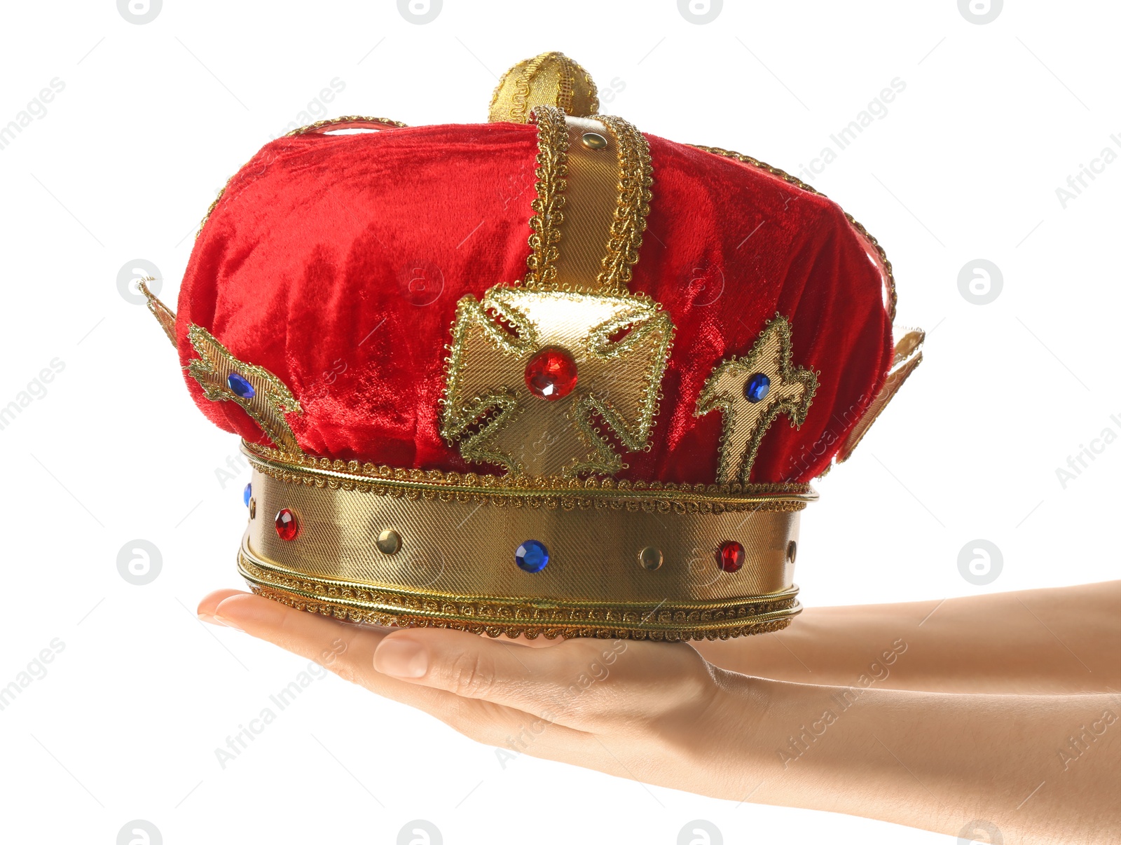 Photo of Woman holding beautiful velvet crown on white background, closeup. Fantasy item