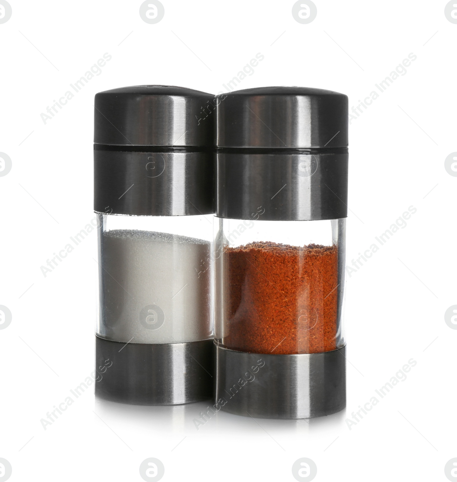 Photo of Salt and pepper shakers on white background