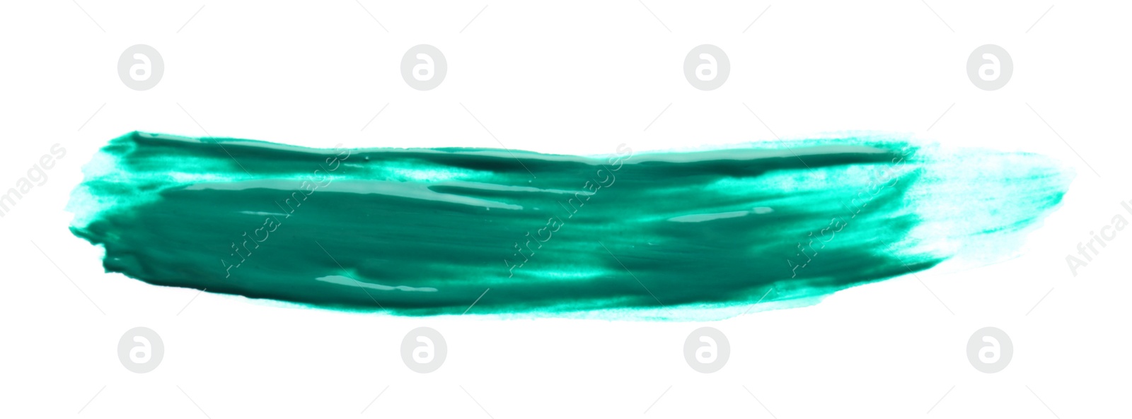 Photo of Abstract brushstroke of green paint isolated on white