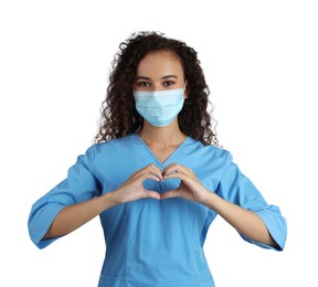 African-American doctor in protective mask making heart with hands on white background