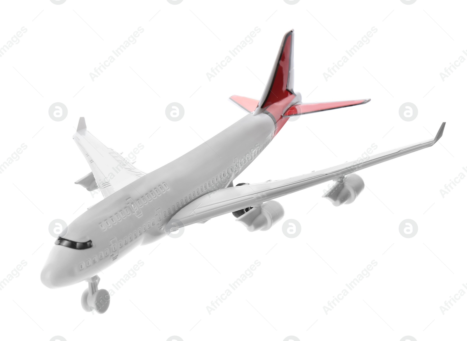 Photo of Toy airplane isolated on white. Travel concept