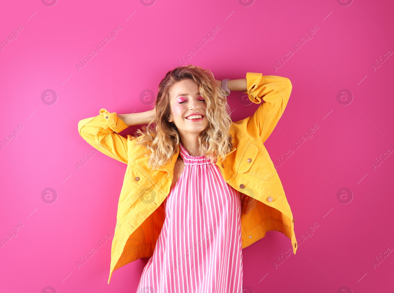 Photo of Beautiful young woman posing on color background. Summer fashion