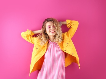 Photo of Beautiful young woman posing on color background. Summer fashion