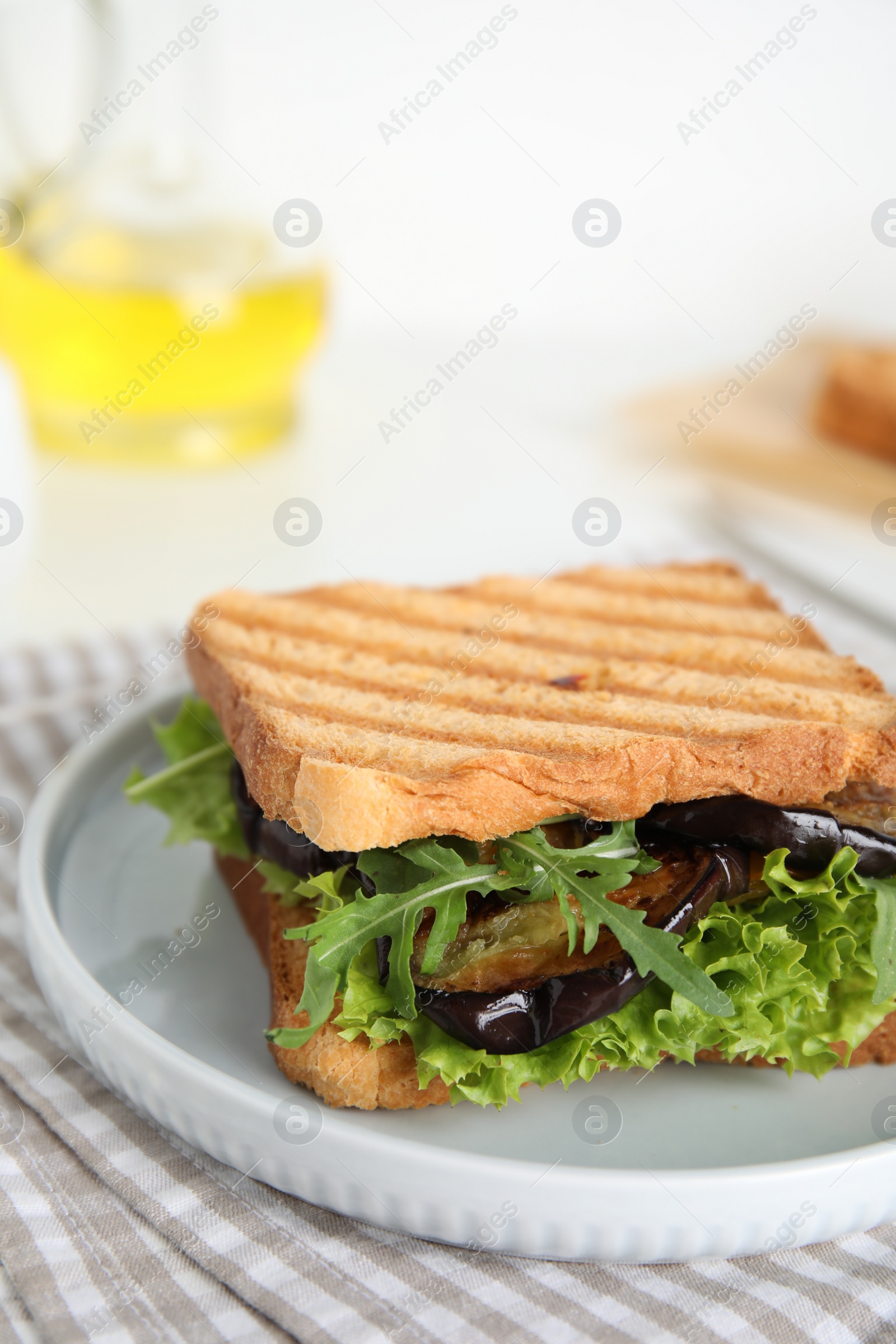 Photo of Delicious fresh sandwich with eggplant served on table