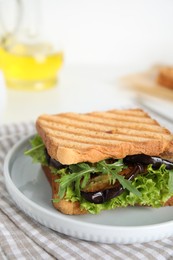 Photo of Delicious fresh sandwich with eggplant served on table