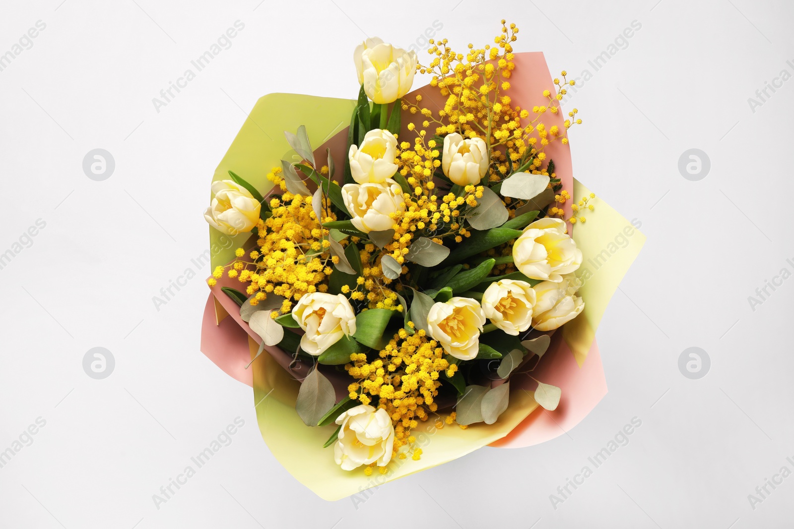 Photo of Bouquet of beautiful spring flowers on light grey background, top view