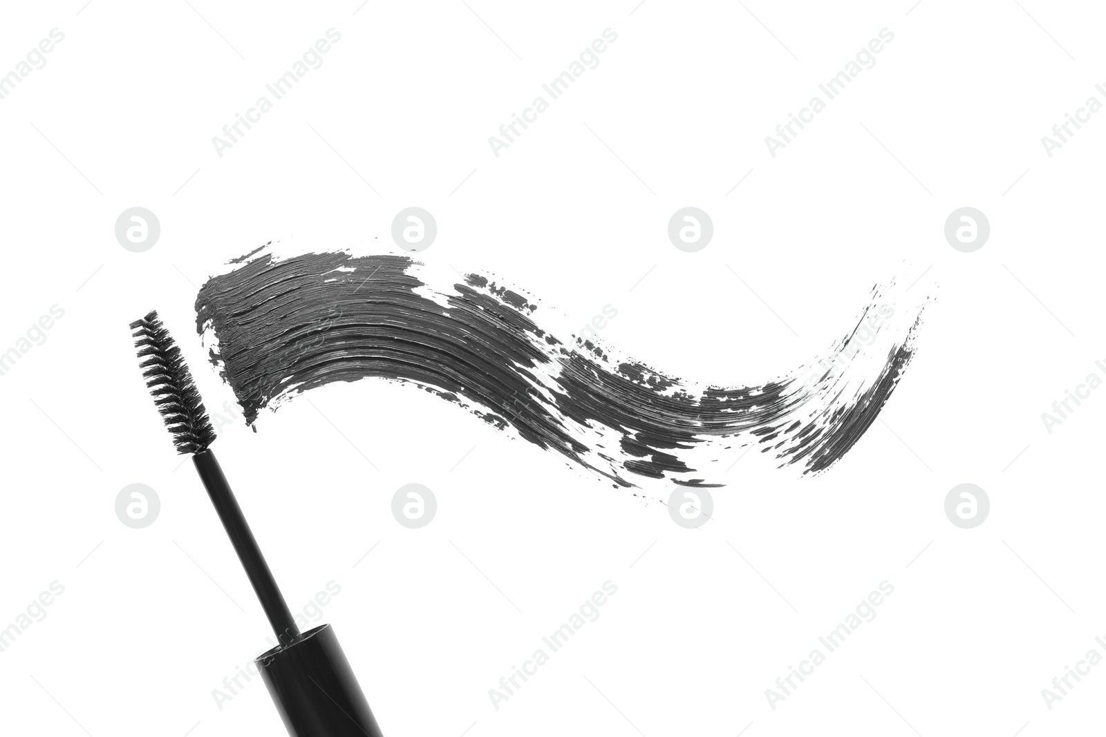 Photo of Smear of mascara and applicator isolated on white, top view