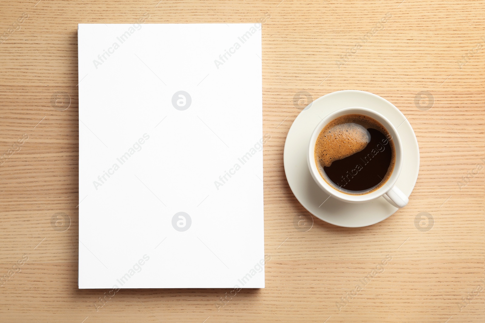 Photo of Blank paper sheets for brochure and cup of coffee on wooden background, flat lay. Mock up