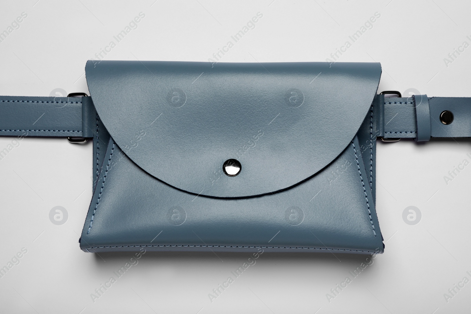 Photo of Stylish woman's bag on light background, top view