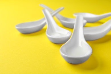 Photo of Clean Miso soup spoons on yellow background