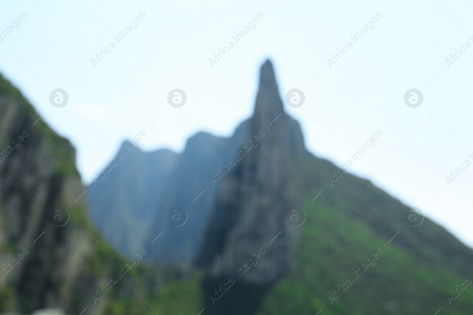 Photo of Blurred view of high mountains under sky outdoors