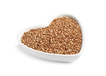 Bowl with uncooked buckwheat on white background