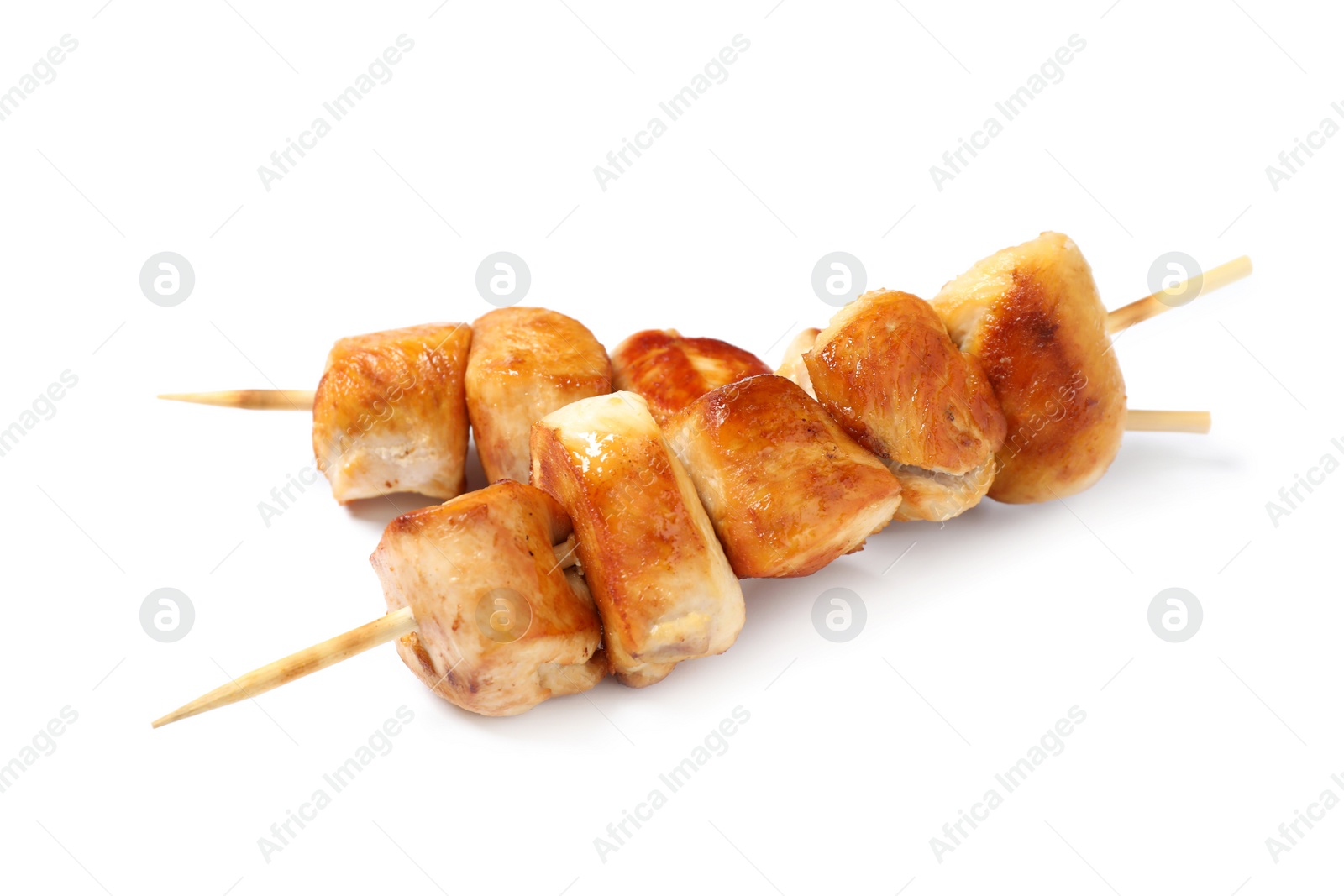 Photo of Delicious chicken shish kebabs on white background