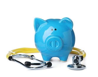 Photo of Piggy bank with stethoscope isolated on white