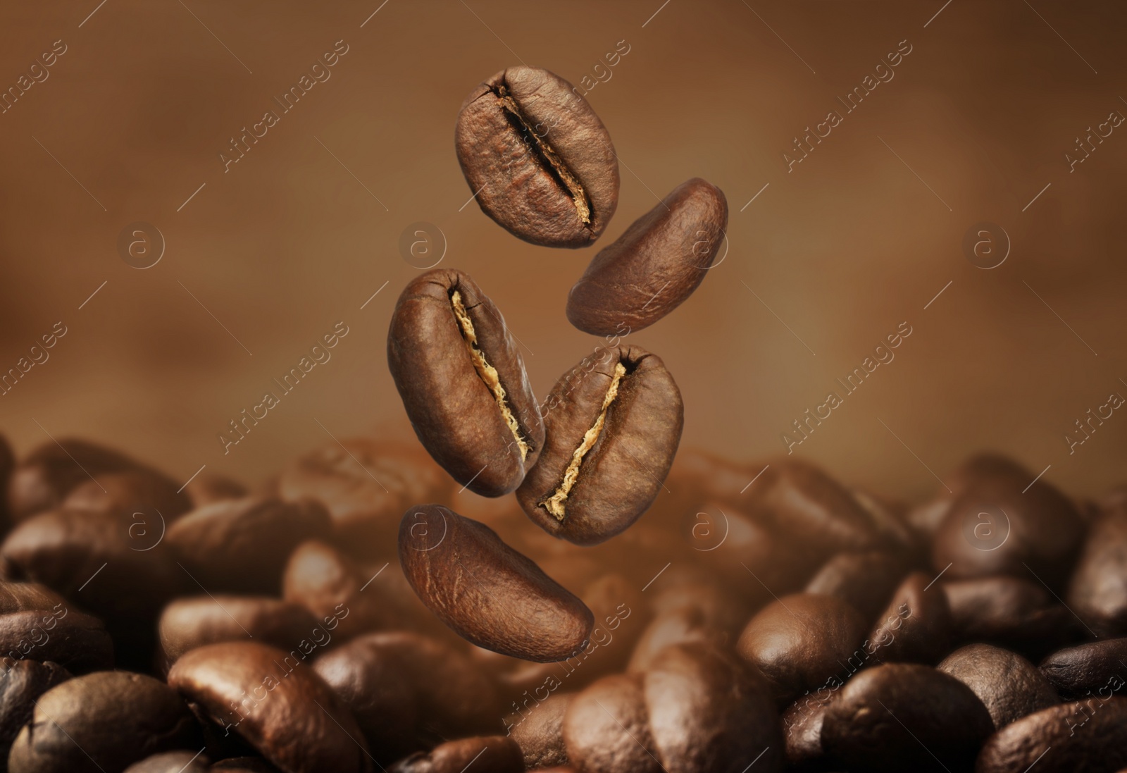 Image of Falling aromatic roasted coffee beans, closeup view