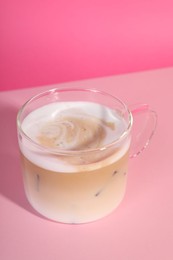 Cup of fresh coffee on pink background