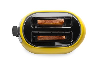 Photo of Yellow toaster with roasted bread slices on white background, top view