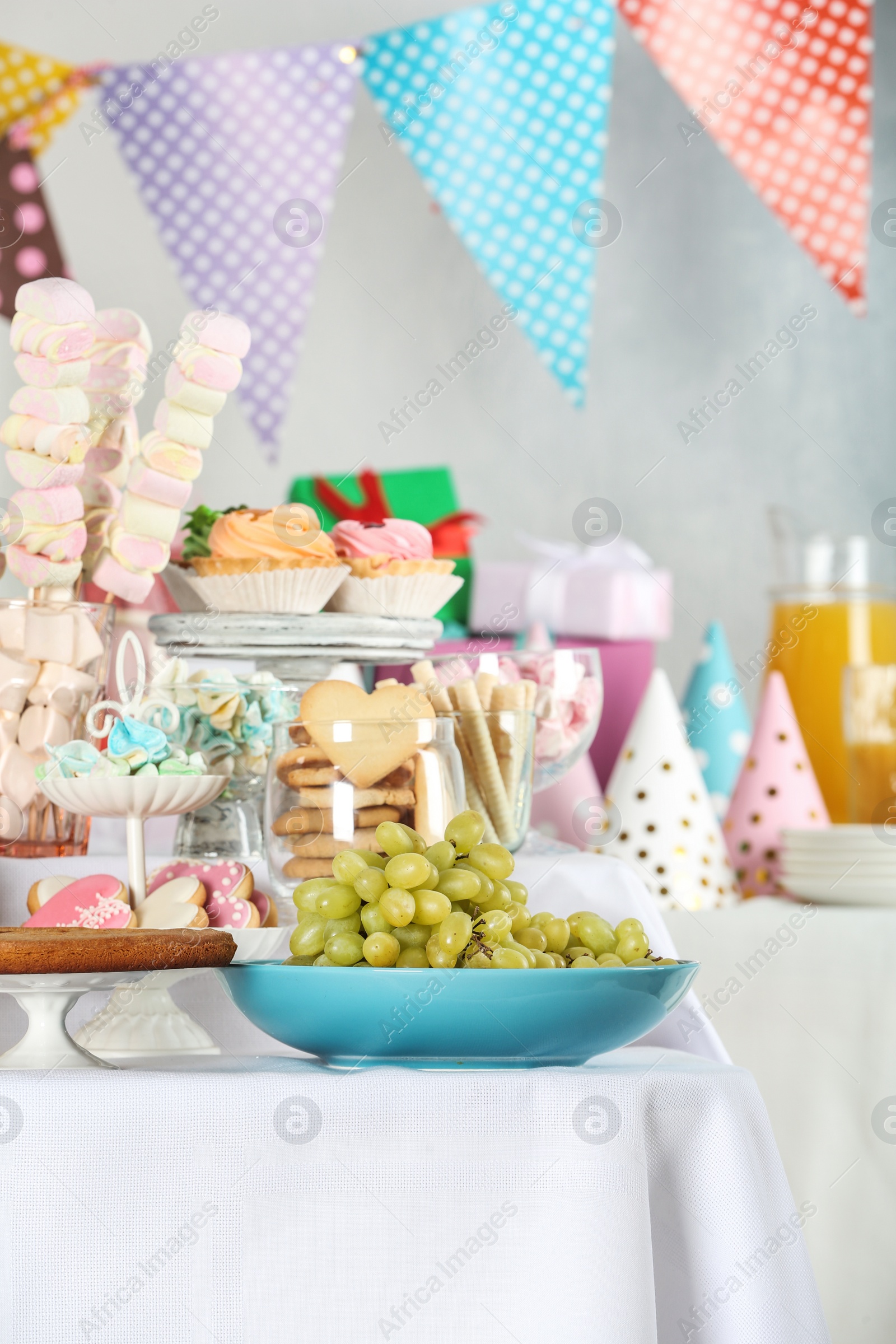 Photo of Candy bar with delicious treats for birthday party