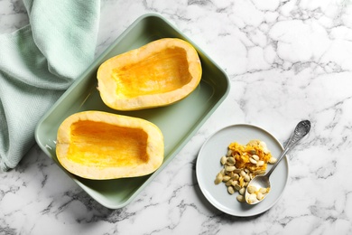 Photo of Flat lay composition with cut spaghetti squash and seeds on marble background
