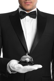 Photo of Butler holding service bell on white background, closeup