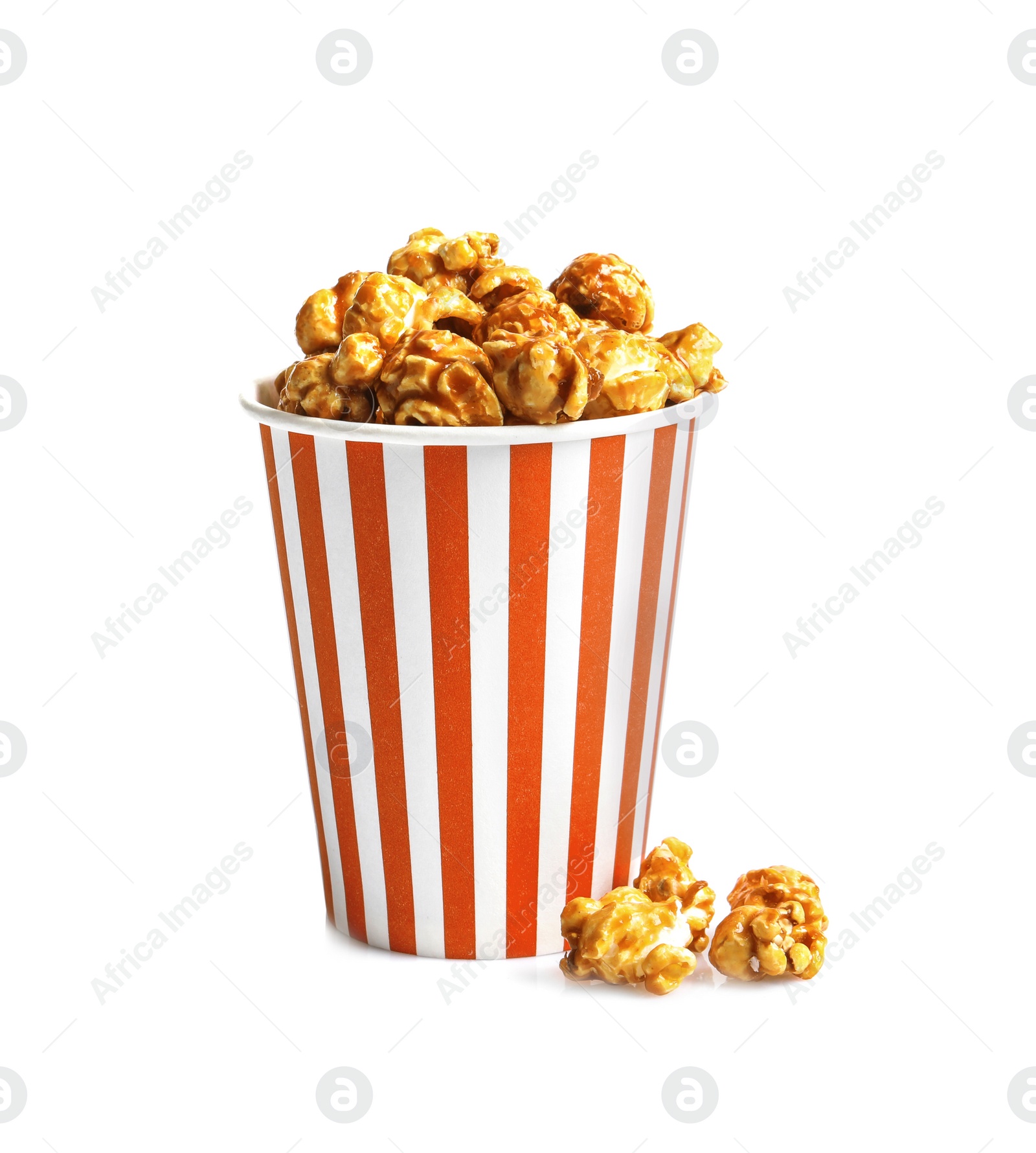 Photo of Delicious popcorn with caramel in paper bucket on white background