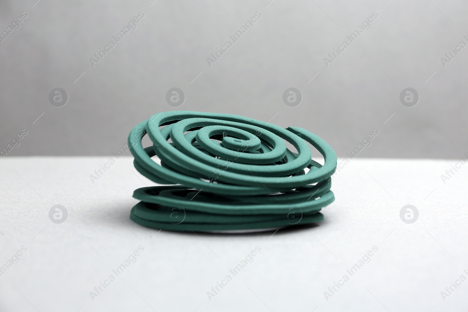 Photo of New insect repellent coils on grey background