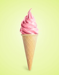 Delicious soft serve berry ice cream in crispy cone on pastel green yellow background