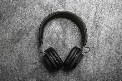 Photo of Stylish headphones on grey background, top view