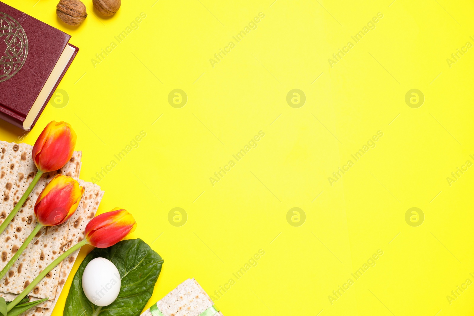 Photo of Flat lay composition with symbolic Pesach (Passover Seder) items on yellow background, space for text