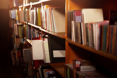 Image of Collection of different books on shelves in library